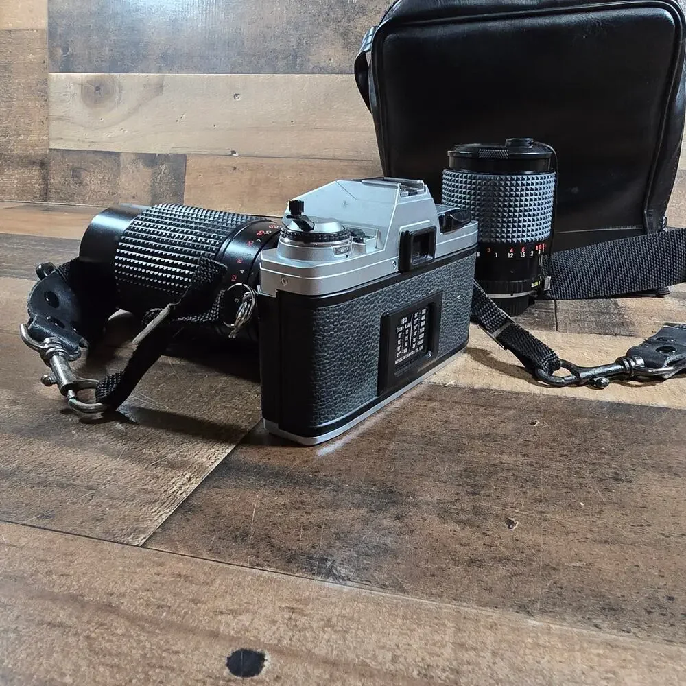 Minolta X370 with a JC Penny f=80 to 200mm zoom lens and prospect f=28-70mm lens